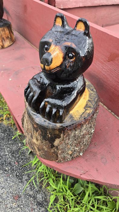 Bear cub in log chainsaw carving 1