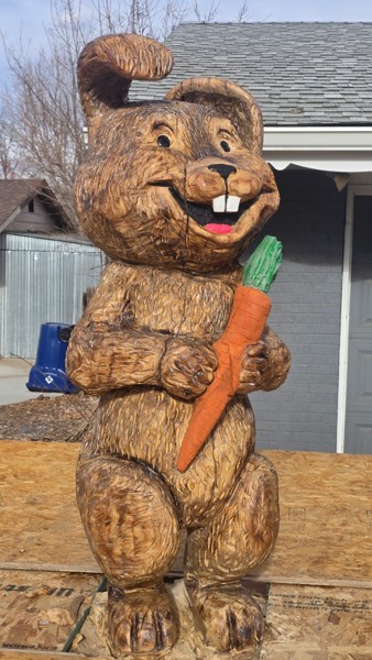 Chainsaw carved wooden rabbit sculpture front view